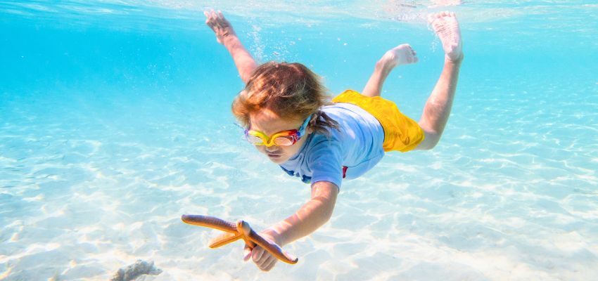 water sports for kids (1) The child is snorkeling.