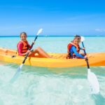 The siblings are trying out water sports for the kids.