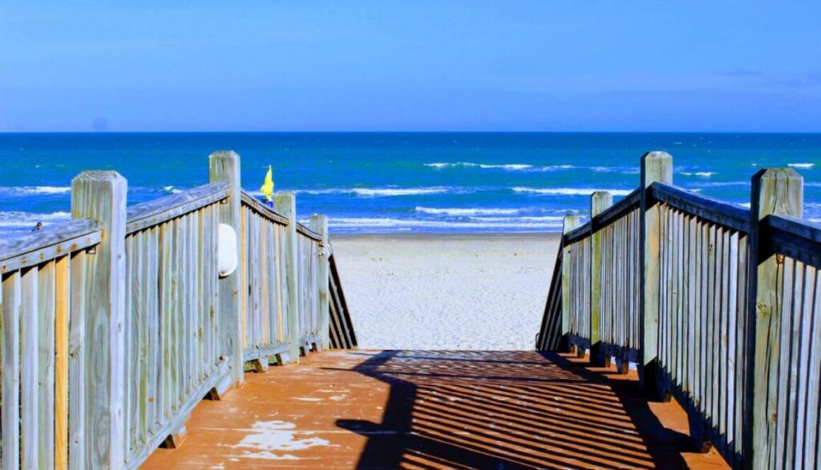 Wooden boardwalk leading to the beach, a starting point for eco tours south padre island.
