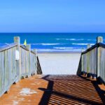 Wooden boardwalk leading to the beach, a starting point for eco tours south padre island.