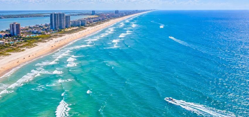 Aerial coastal view similar to the perspective gained when learning how high is parasailing.