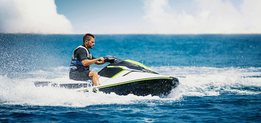 Rider speeding across the waves on a Sea-Doo during a sea doo rental South Padre Island adventure.